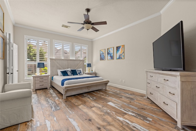 bedroom with wood-type flooring, a textured ceiling, crown molding, and ceiling fan