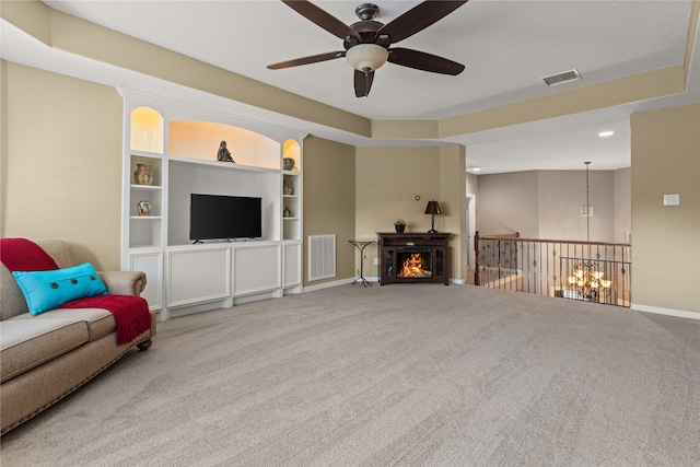 living room featuring ceiling fan and carpet floors