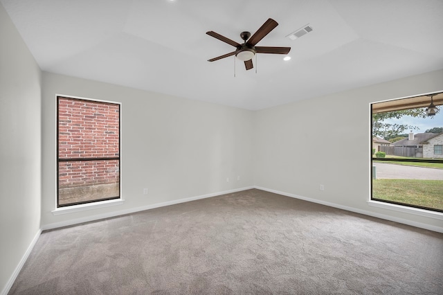 unfurnished room featuring ceiling fan, carpet flooring, and vaulted ceiling