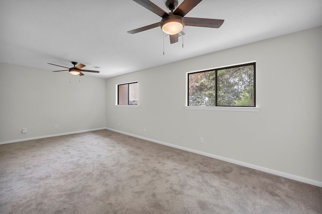 empty room with carpet and ceiling fan