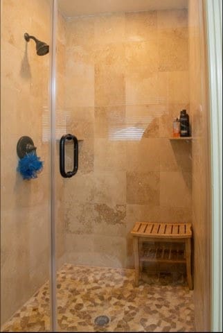 bathroom featuring an enclosed shower