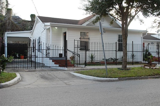 view of front of home with a carport