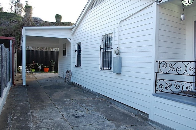 view of side of home featuring a patio