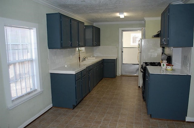 kitchen with light tile patterned flooring, tasteful backsplash, sink, and plenty of natural light