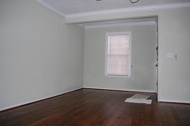 spare room with ornamental molding and hardwood / wood-style flooring