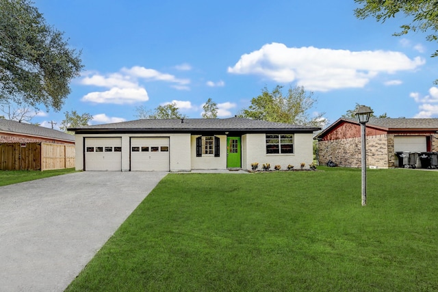 single story home featuring a garage and a front yard