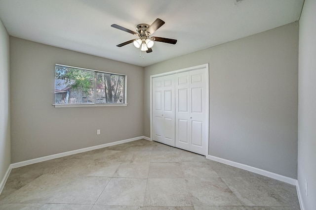 unfurnished bedroom with a closet, light tile patterned floors, and ceiling fan