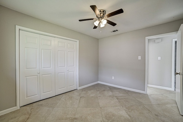 unfurnished bedroom with a closet, ceiling fan, and light tile patterned floors