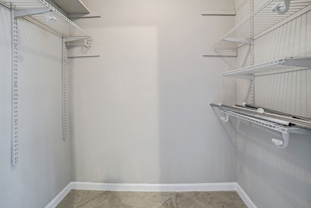 spacious closet featuring tile patterned floors