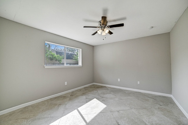 tiled empty room with ceiling fan