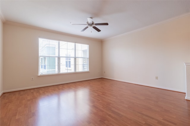 unfurnished room featuring wood-type flooring, ornamental molding, and ceiling fan