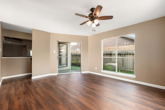 spare room with wood-type flooring and ceiling fan