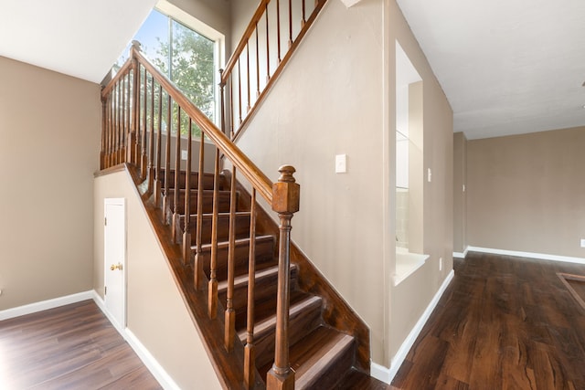 staircase featuring hardwood / wood-style flooring