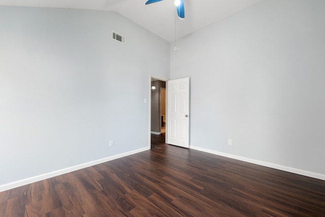 empty room with dark wood-style floors, ceiling fan, visible vents, and baseboards