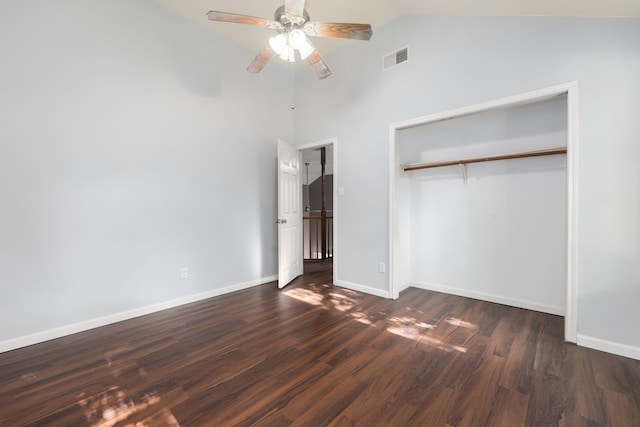 unfurnished bedroom featuring dark wood-type flooring, a closet, visible vents, and baseboards