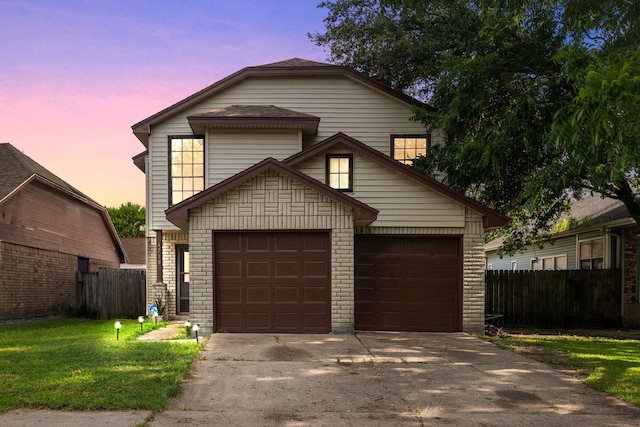 view of property featuring a garage, an outbuilding, and a lawn