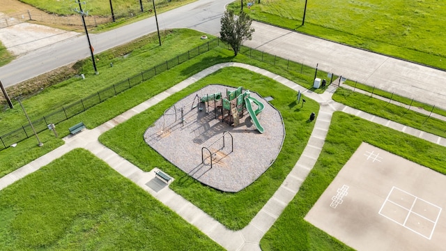 view of property's community with fence and playground community