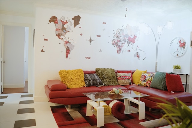 living room with tile patterned floors and crown molding