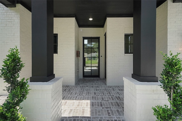 property entrance with covered porch