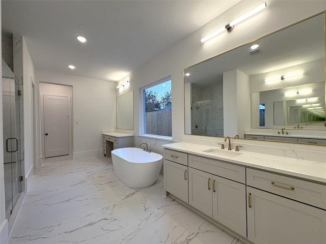 bathroom featuring vanity and separate shower and tub