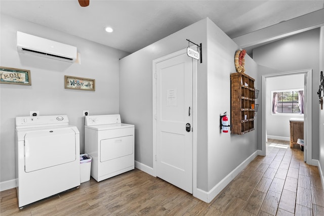 washroom with washing machine and clothes dryer and a wall unit AC