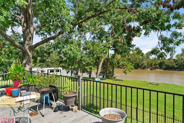 deck featuring a water view and a yard