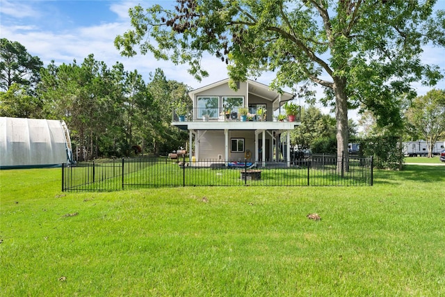 view of yard with a balcony