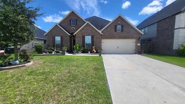 view of front of home featuring a garage and a front yard