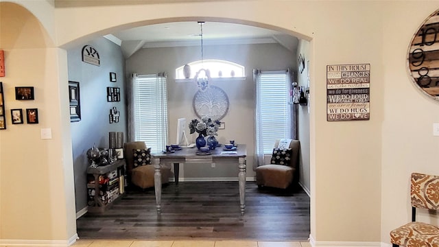 interior space featuring lofted ceiling and light wood-type flooring