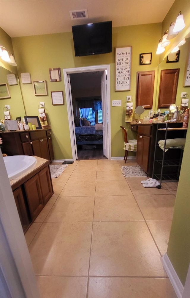 bathroom with tile patterned floors and sink