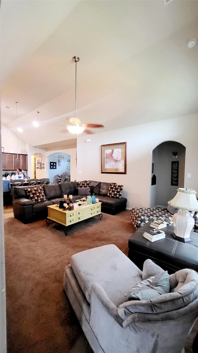 living room with vaulted ceiling, carpet flooring, and ceiling fan