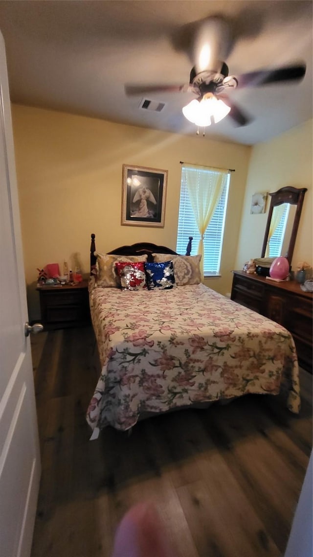 bedroom featuring wood-type flooring and ceiling fan