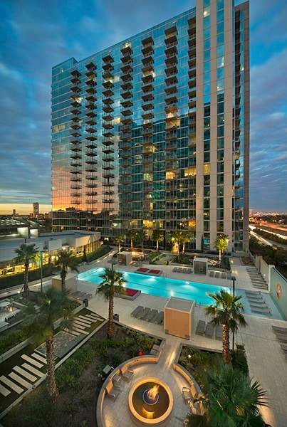 pool at dusk with a patio