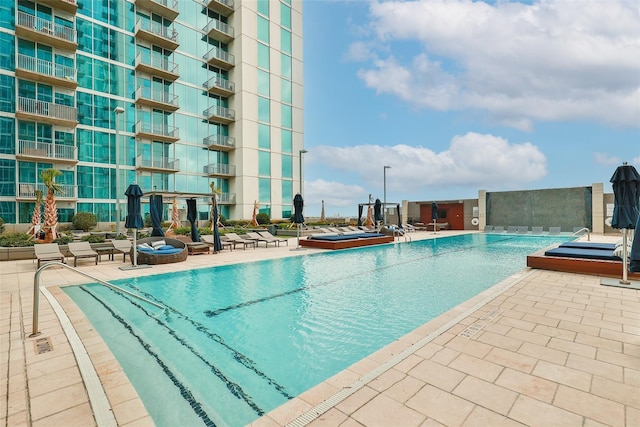 view of swimming pool featuring a patio area