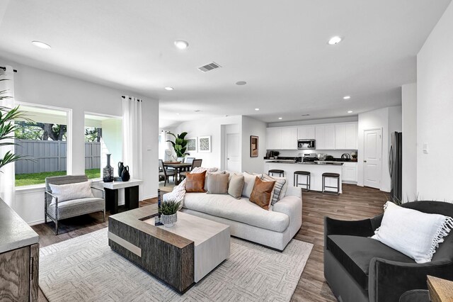 living room with light hardwood / wood-style flooring