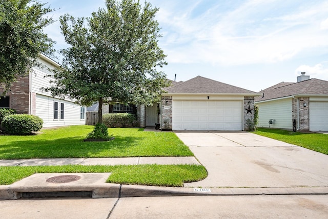 view of front of home with a garage, driveway, a front lawn, and a shingled roof