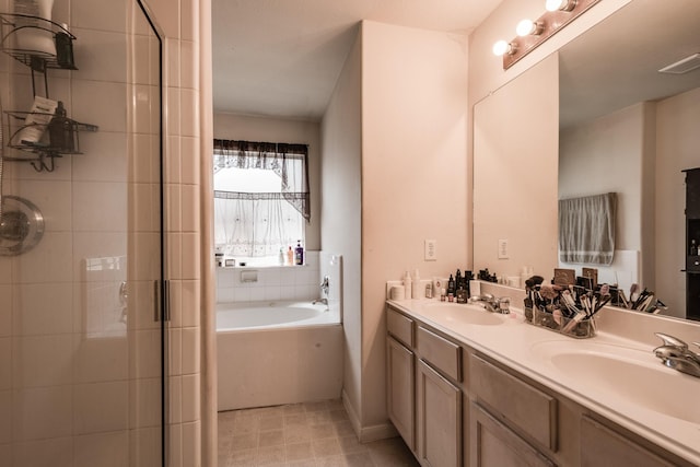 bathroom featuring a bath, tile patterned flooring, double vanity, and a sink