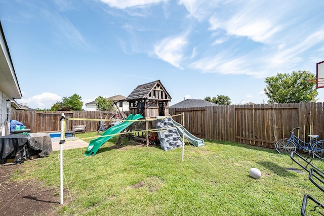 view of jungle gym featuring a fenced backyard and a yard