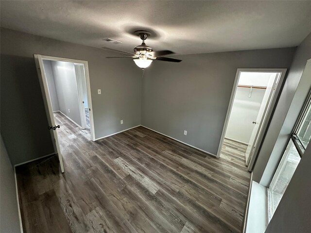 spare room featuring ceiling fan and hardwood / wood-style floors