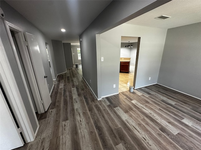 hall with hardwood / wood-style flooring