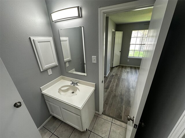 bathroom with wood-type flooring and vanity