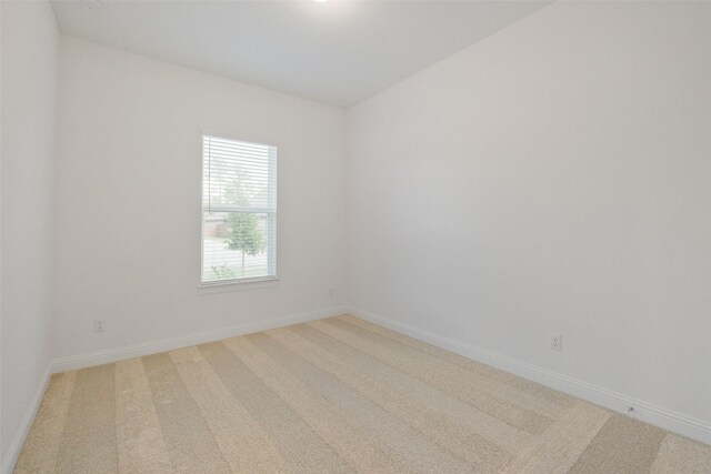 16006 Ruby Laurel Ct, Conroe, TX 77302 - empty room featuring light colored carpet and baseboards