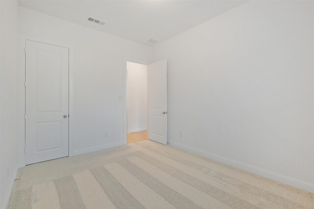 16006 Ruby Laurel Ct, Conroe, TX 77302 - unfurnished bedroom with light colored carpet and baseboards