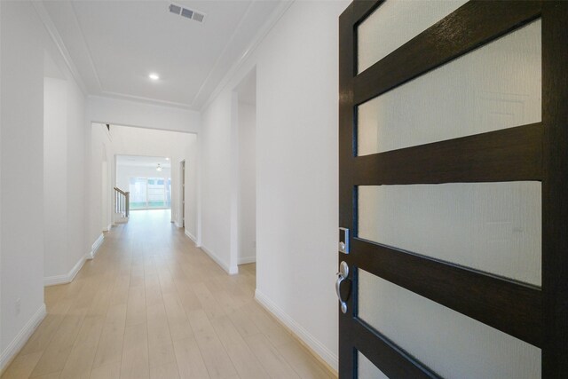 16006 Ruby Laurel Ct, Conroe, TX 77302 - hallway with baseboards, light wood-style floors, ornamental molding, and recessed lighting