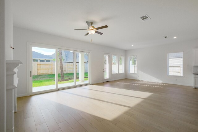 16006 Ruby Laurel Ct, Conroe, TX 77302 - empty room with a ceiling fan, baseboards, light wood-style flooring, and recessed lighting