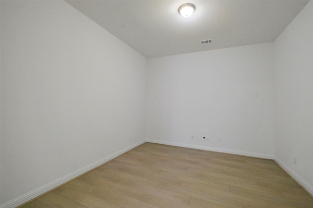 16006 Ruby Laurel Ct, Conroe, TX 77302 - unfurnished room with light wood-type flooring and baseboards