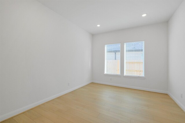 16006 Ruby Laurel Ct, Conroe, TX 77302 - unfurnished room featuring light wood-style floors, recessed lighting, and baseboards