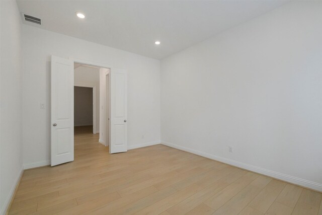 16006 Ruby Laurel Ct, Conroe, TX 77302 - empty room with light wood-style floors, baseboards, and recessed lighting