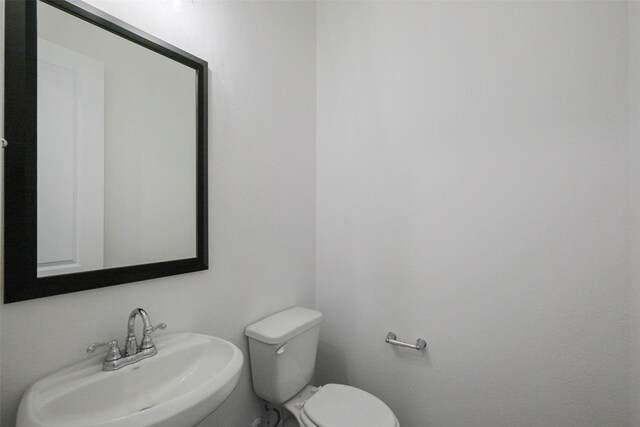 16006 Ruby Laurel Ct, Conroe, TX 77302 - half bath featuring a sink and toilet