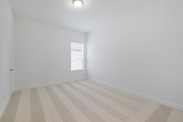 16006 Ruby Laurel Ct, Conroe, TX 77302 - empty room with baseboards and light carpet